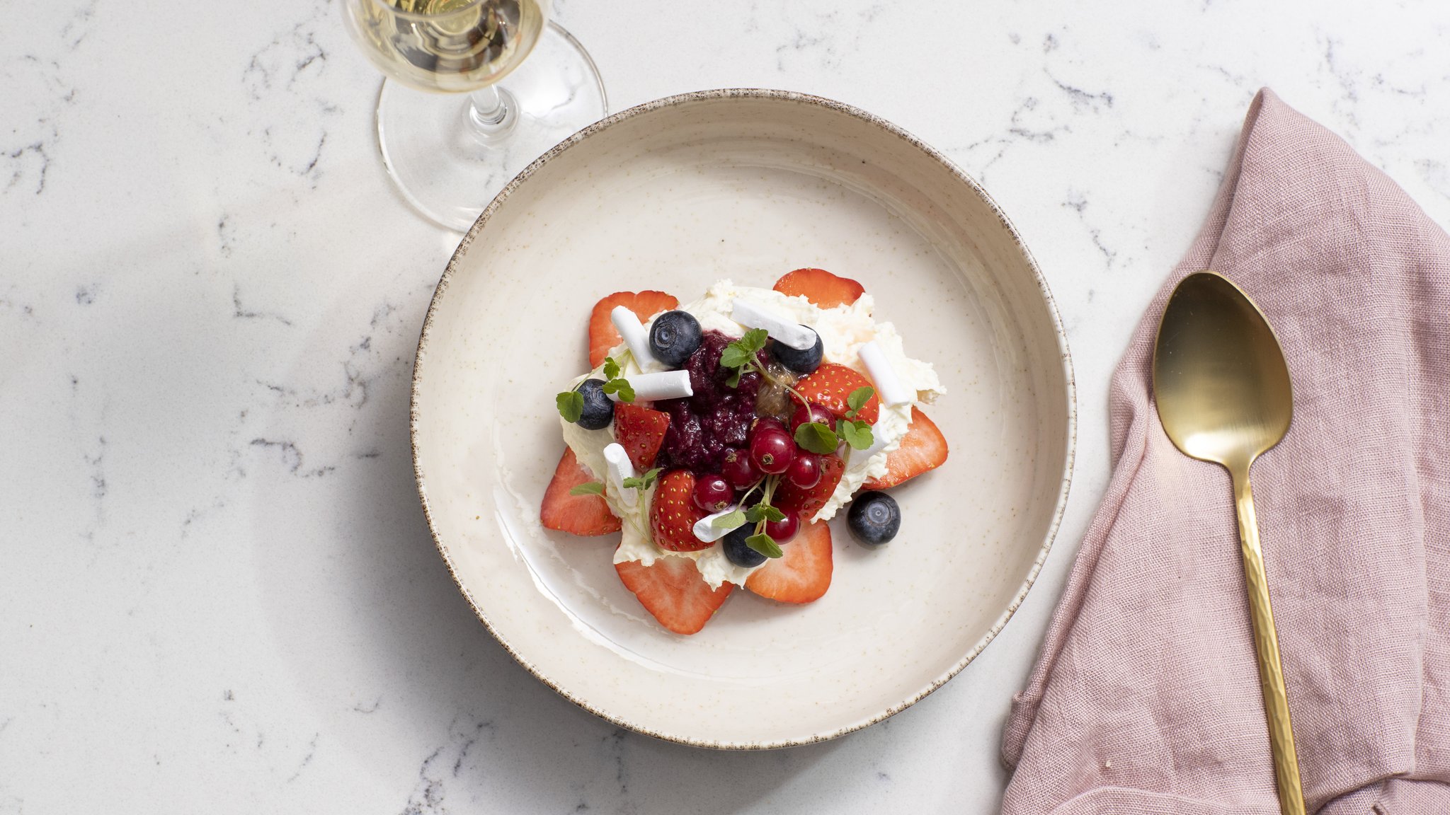 Strawberry dessert with blue berries and red fruit